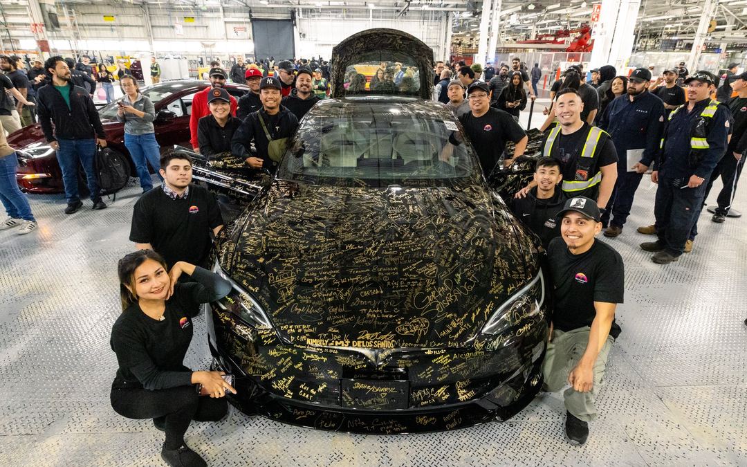 Tesla team at Fremont Factory with the last cars built
