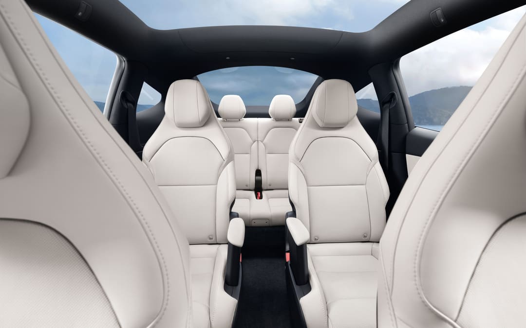 Model Y Long Wheelbase cabin from the back: light seats in three rows under the glass roof