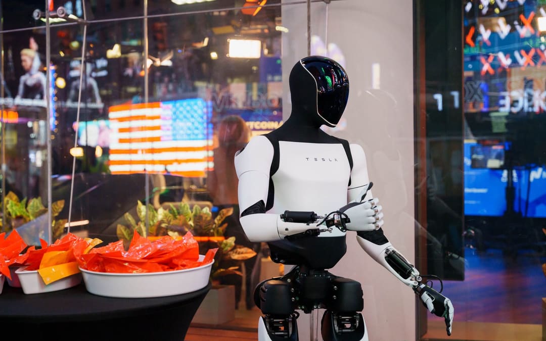 White Optimus standing beside a food table at an indoor event