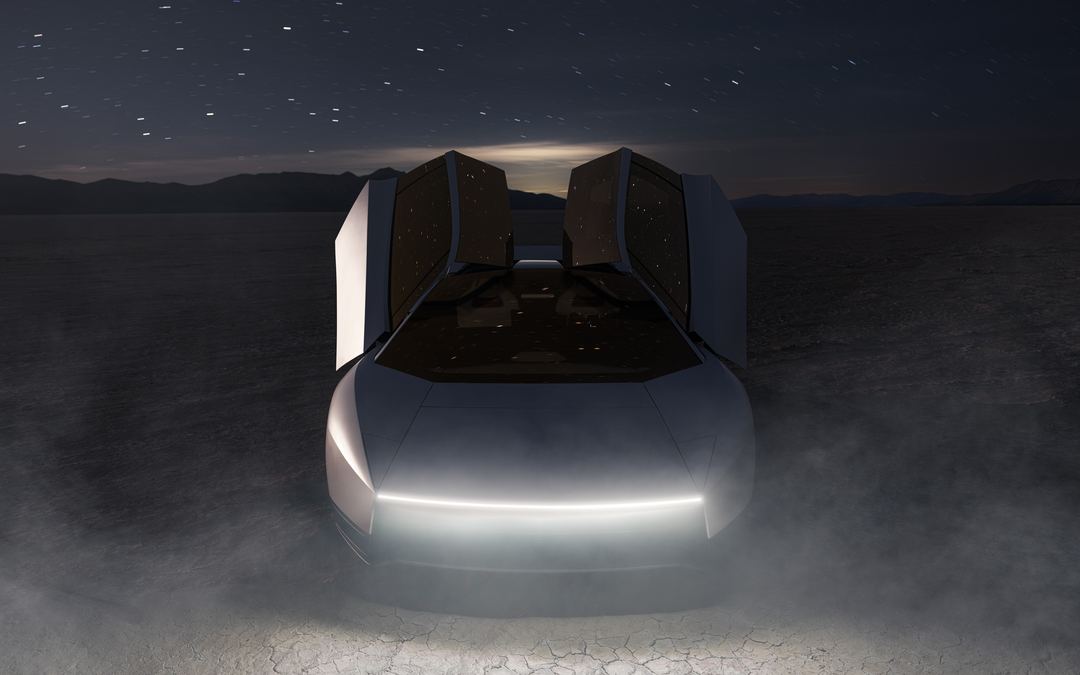 Tesla Roadster at night in the desert, doors up, seen from the front