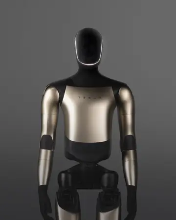 Optimus standing front-on against a grey studio backdrop, black and metallic gold body panels