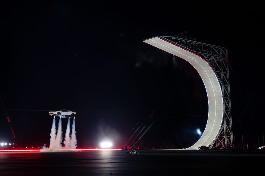 Tesla Roadster. Night demo: hovering on four thruster plumes beside the loop