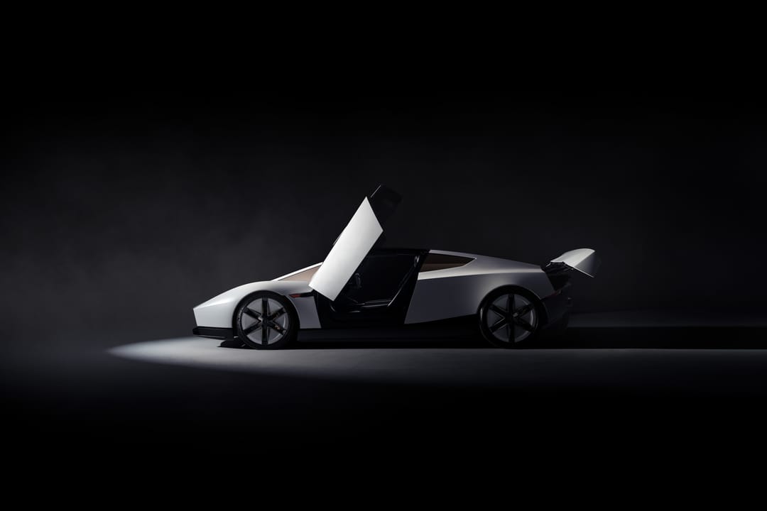 Tesla Roadster in a dark studio, side profile with doors and rear wing raised